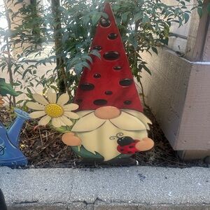Garden Gnome with Red Hat and Yellow Flower